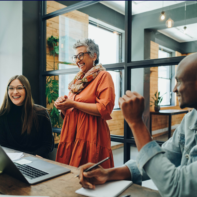 Diverse team in a meeting with a laptop