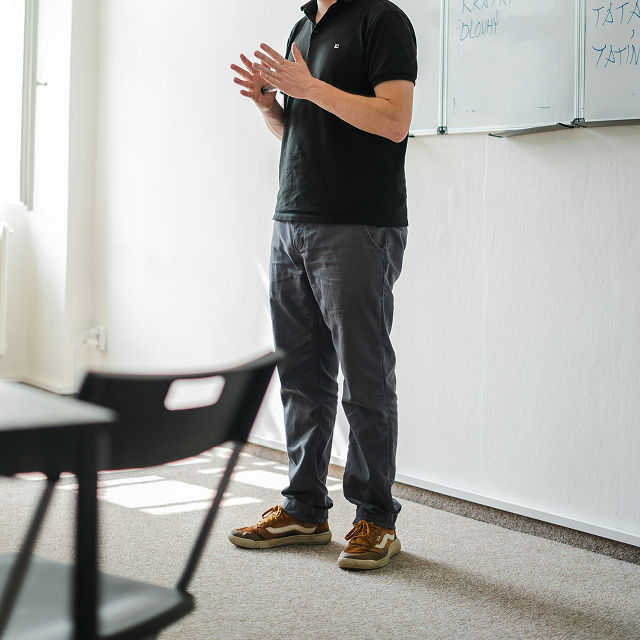 Presenter in front of a whiteboard during a session